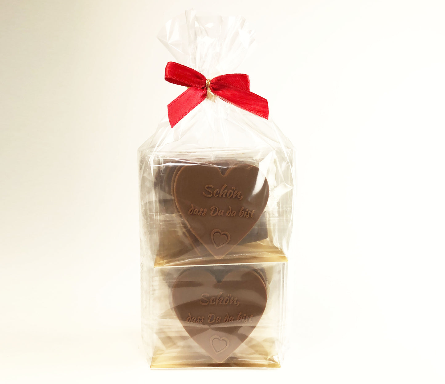 Gastgeschenke Schokoladenherzen - 12 St. aus Vollmilch-Schokolade - 'Schön, dass du da bist' für Gastfreundschaft und besondere Anlässe - Tischdekoration oder Torten-Verzierung